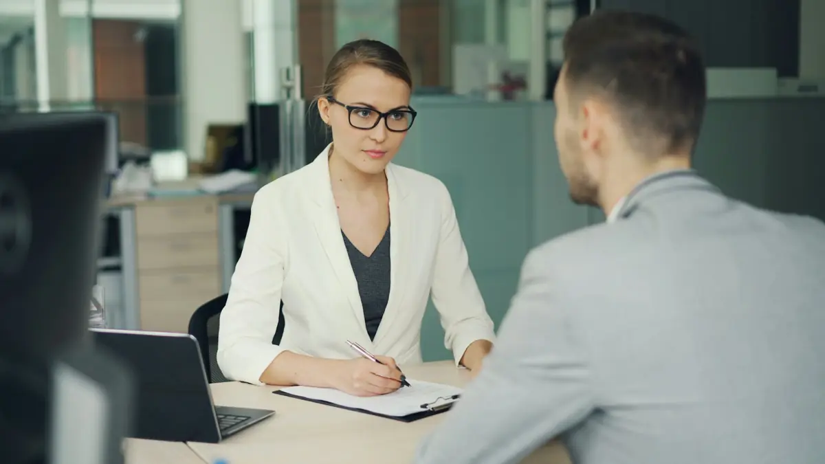 A HYRA recruiter in conversation with a candidate