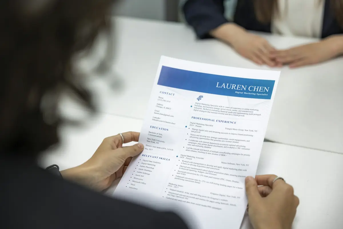 A reviewer examining a candidate resume